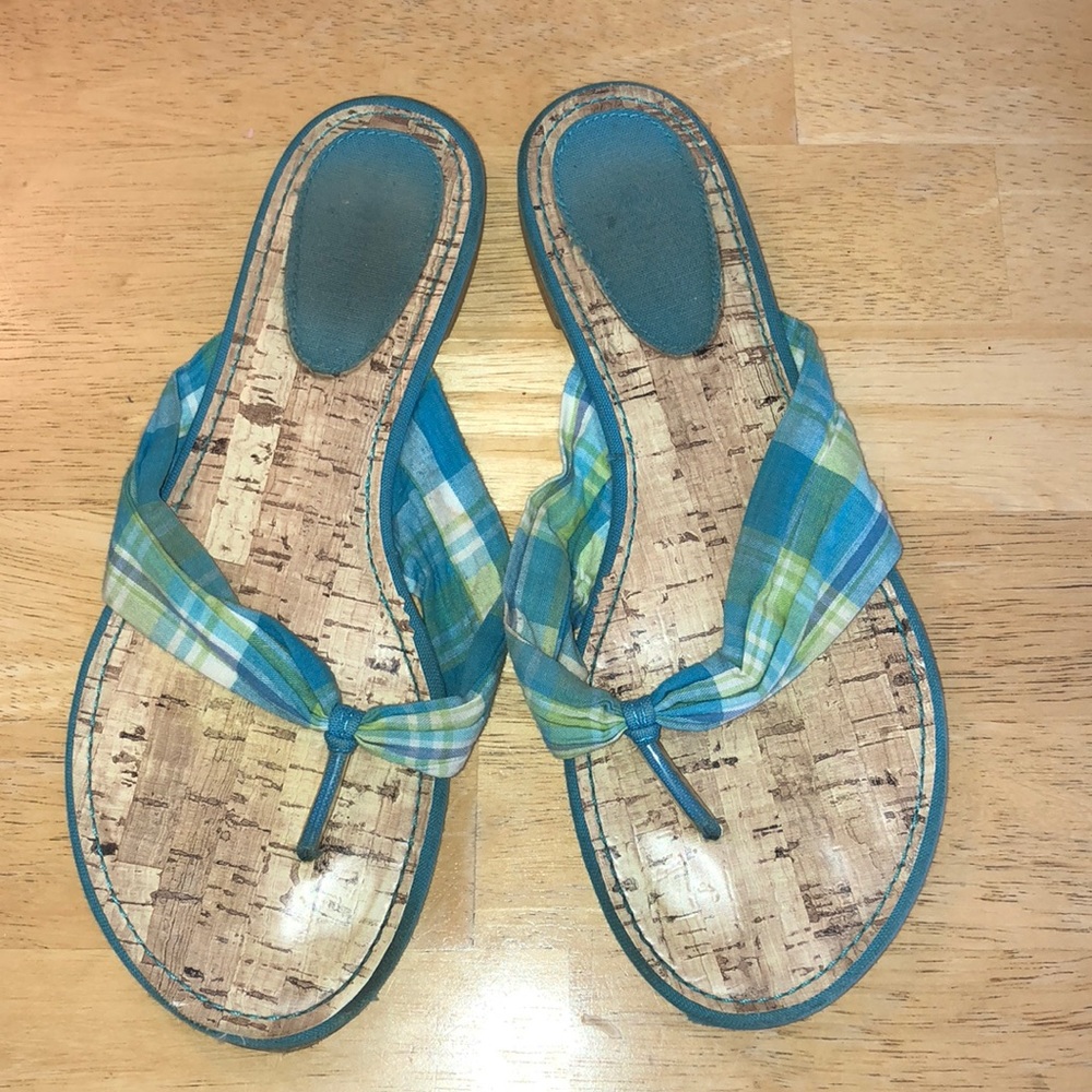 Blue and green flip flops